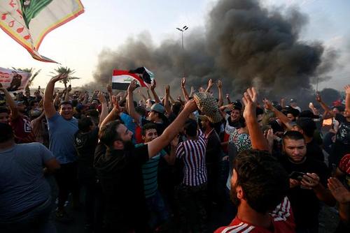 18کشته در اعتراضات عراق +عکس